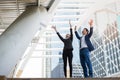 Asian businessman and businesswoman throwing paper in the air and raising up two hands to celebrated for business successful Royalty Free Stock Photo