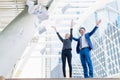 Asian businessman and businesswoman throwing paper in the air to cheerful and celebrated for business successful. Royalty Free Stock Photo