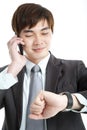 Asian businessman checking time