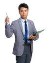 Asian businessman with clipboard and pen point up Royalty Free Stock Photo