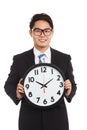 Asian businessman with a clock