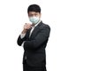 Asian businessman with glasses wearing  face mask in black suit jacket, his hand holding a pen, and look at the camera Royalty Free Stock Photo