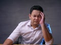 Asian Businessman Having Headache, Tired Stress Gesture Royalty Free Stock Photo