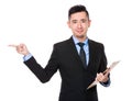 Asian Businessman hold with clipboard and finger point aside Royalty Free Stock Photo