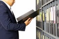 Businessman holding documents file folder from office shelf isolated.