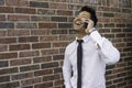 Asian Businessman Laughing and talking on the mobile phone Royalty Free Stock Photo