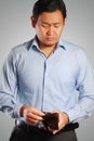 Asian Businessman Looking Sad with Empty Wallet Royalty Free Stock Photo