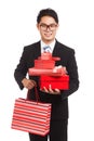 Asian businessman with many gift boxes and shopping bag Royalty Free Stock Photo