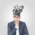 Asian businessman with many questions Royalty Free Stock Photo