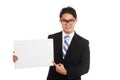 Asian businessman point to blank sign and smile Royalty Free Stock Photo