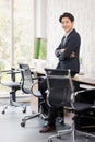 Asian businessman posing to camera, in office Royalty Free Stock Photo