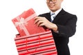 Asian businessman pull gift box from shopping bag Royalty Free Stock Photo