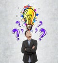 Asian businessman, purple questions and bulb Royalty Free Stock Photo