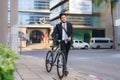 Asian businessman pushing his bicycle from home in the morning preparing to ride his bicycle to work. Eco tranportation
