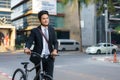 Asian businessman pushing his bicycle from home in the morning preparing to ride his bicycle to work. Eco tranportation Royalty Free Stock Photo