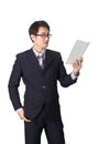 Asian businessman reading notebook or diary for checking, isolated Royalty Free Stock Photo