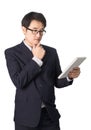 Asian businessman reading notebook or diary for checking, isolated Royalty Free Stock Photo
