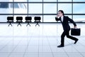 Asian businessman running in the airport Royalty Free Stock Photo