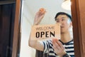 Asian businessman turning round tablet open on door Royalty Free Stock Photo