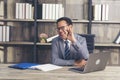 Asian Businessman using laptop at office desk. Man hands typing computer keyboard reading financial graph chart Planning analyzing Royalty Free Stock Photo