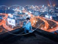 Asian businessman using phone and laptop on rooftop with lines