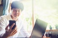 Asian businessman using the smartphone in a coffee shop Royalty Free Stock Photo