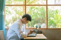 Asian businessman using the smartphone in a coffee shop Royalty Free Stock Photo