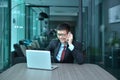 Asian Businessman using smartphone in a conference room Royalty Free Stock Photo