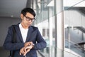 Asian businessman watching time and going to work in the morning Royalty Free Stock Photo