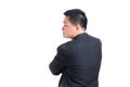 Asian businessman wear black suit Stand up to the back with crossed arms and look at the left hand side. Royalty Free Stock Photo