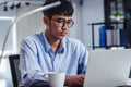 Asian businessman woking with laptop and paper work on desk at office.digital workflow online business lifestyle concept