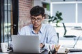 Asian businessman woking with laptop and paper work on desk at office.digital workflow online business lifestyle concept