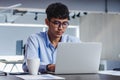 Asian businessman woking with laptop and paper work on desk at office.digital workflow online business lifestyle concept