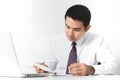 Asian businessman working seriously in the office with laptop co Royalty Free Stock Photo