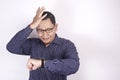 Asian Businessman Worried by Time, Work Deadline Stress