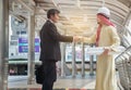Asian businessmen and Arab architects have handshake agreed on a Royalty Free Stock Photo