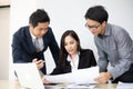 Asian businessmen and group using notebook for business partners discussing documents and ideas at meeting and business women Royalty Free Stock Photo