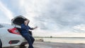 Asian businessmen talking on a cell phone by a broken car On Country Road Phoning For Help.Broken Car On The Road in During rush Royalty Free Stock Photo