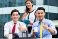 Asian businesspeople working outside with coffee Royalty Free Stock Photo