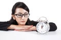 Asian businesswoman with alarm clock