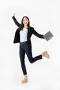 Asian businesswoman in black suit joyful jumping with celebrating successful isolated on white background studio shot.