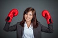 Asian businesswoman with boxing glove show her fists Royalty Free Stock Photo