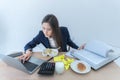 Asian businesswoman busy at work She ate while working because she was in a hurry to complete her goals Royalty Free Stock Photo