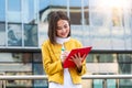 Asian Businesswoman in casual wear writing on clipboard. business woman holding clipboard. Modern, hardworking woman holding clip Royalty Free Stock Photo