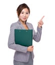 Asian businesswoman with clipboard and finger point up Royalty Free Stock Photo