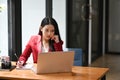 Businesswoman concentrated working while sitting in her office room. Royalty Free Stock Photo