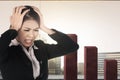 Asian businesswoman feeling depressed with global economic impact Royalty Free Stock Photo
