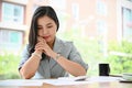 Asian businesswoman or female entrepreneur concentrated reading a business document