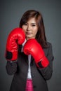 Asian businesswoman guard with boxing glove Royalty Free Stock Photo