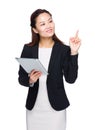 Asian businesswoman hold tablet and finger point up Royalty Free Stock Photo